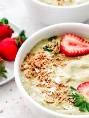 Strawberry Avocado Smoothie Bowl with side plate of strawberries