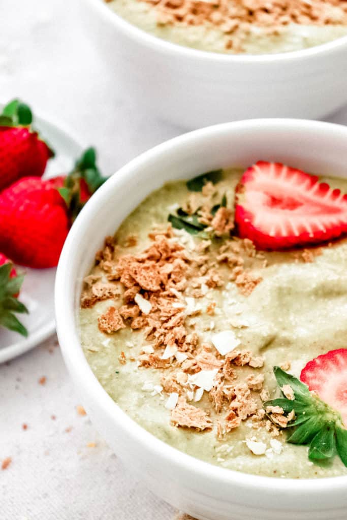 Strawberry Avocado Smoothie Bowl with side plate of strawberries