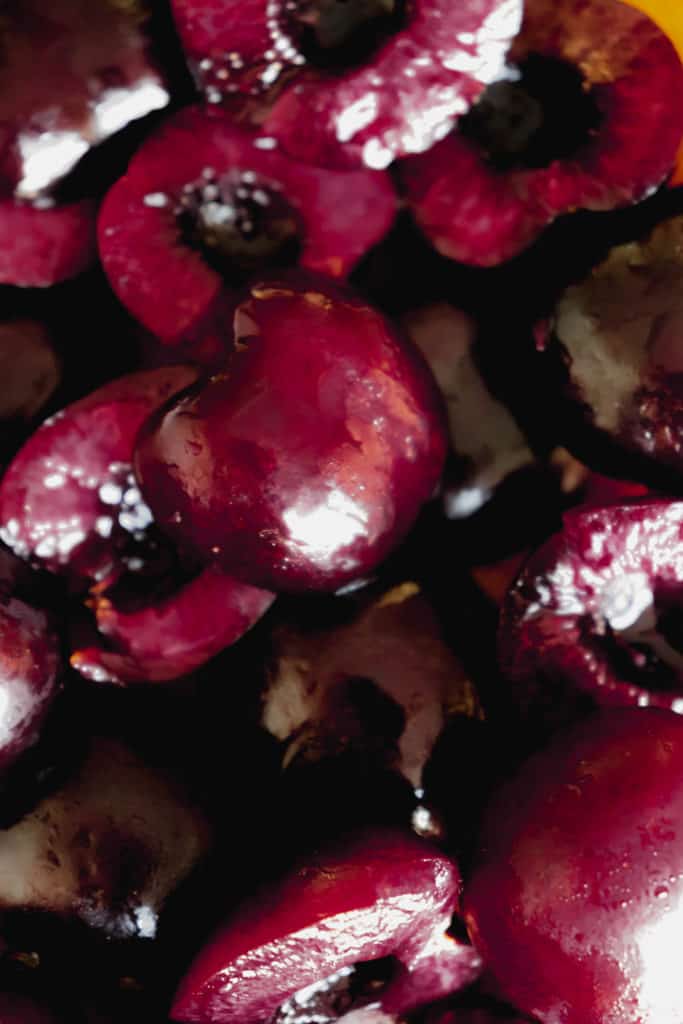 close up image of sliced and pitted sweet cherries