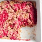 close up image of white baking dish with strawberry AIP baked panca with one square removed