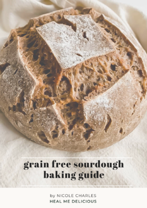 ebook cover featuring large round boule of sourdough bread with the words grain free sourdough baking guide, by nicole charles heal me delicious