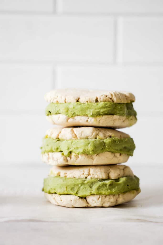 three matcha ice cream sandwiches stacked on top each other