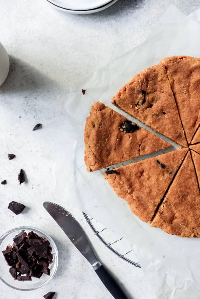 Sweet Potato Cookie Bar sliced into triangles with scattered carob chunks