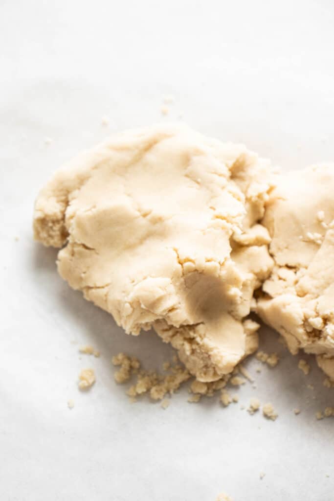 overhead shot of pastry dough on a white piece of parchment paper