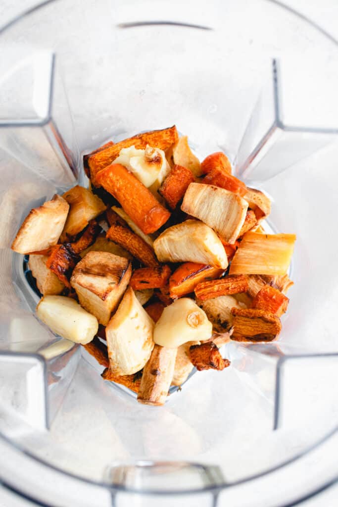 chopped, roasted carrots, parsnips and carrots in a Vitamix