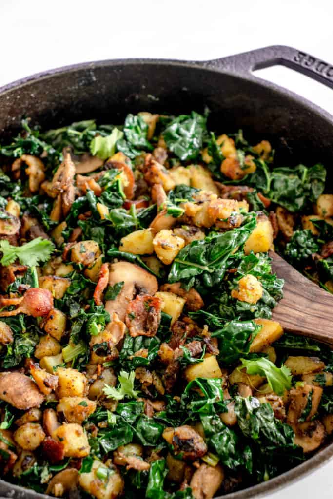 black cast iron skillet with Sweet Potato Hash with Bacon and Kale