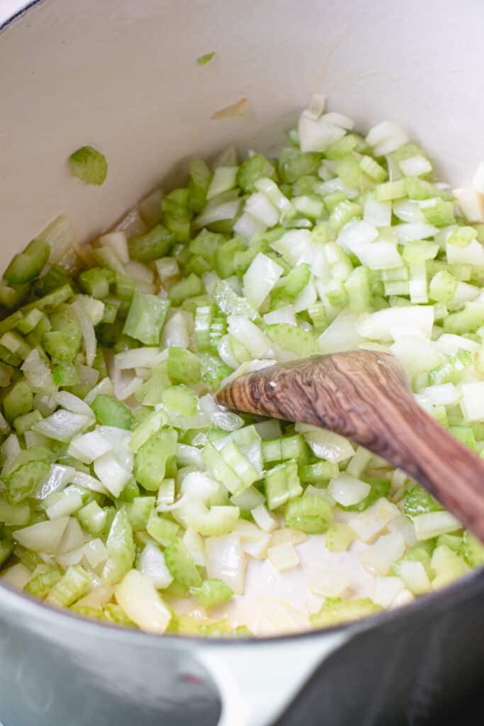 Chopped celery and onions in a stockpot.