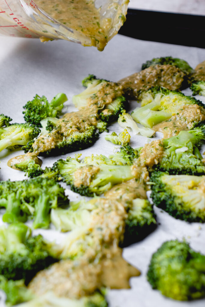 Ginger-cilantro marinade drizzled on top of smashed broccoli