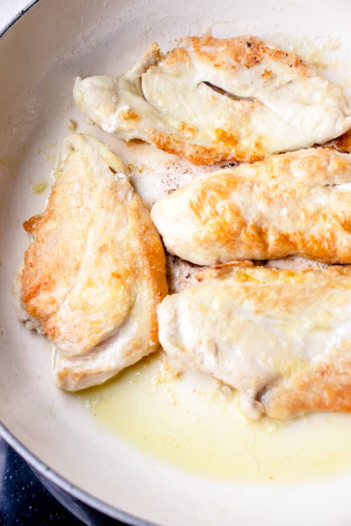 Pan-seared chicken in a pan
