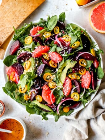 A colorful beet and citrus salad with fruits and vegetables allowed on the AIP diet.