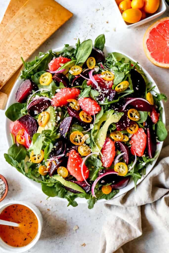 A colorful beet and citrus salad with fruits and vegetables allowed on the AIP diet.