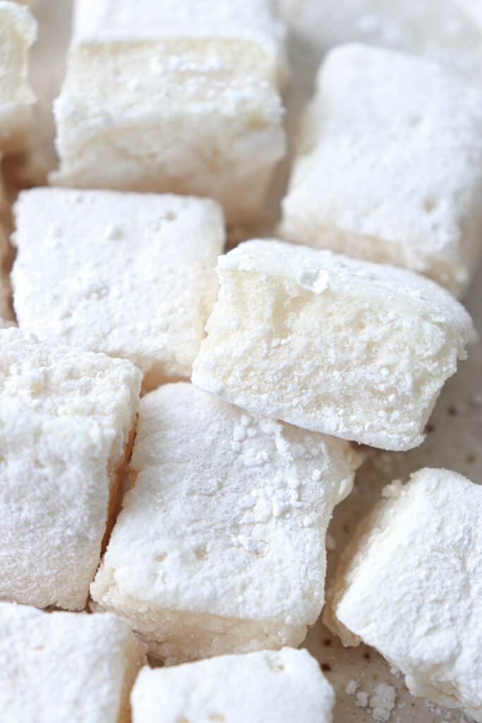 Close up shot of large, white, puffy Gluten-Free Marshmallows coated with arrowroot starch.
