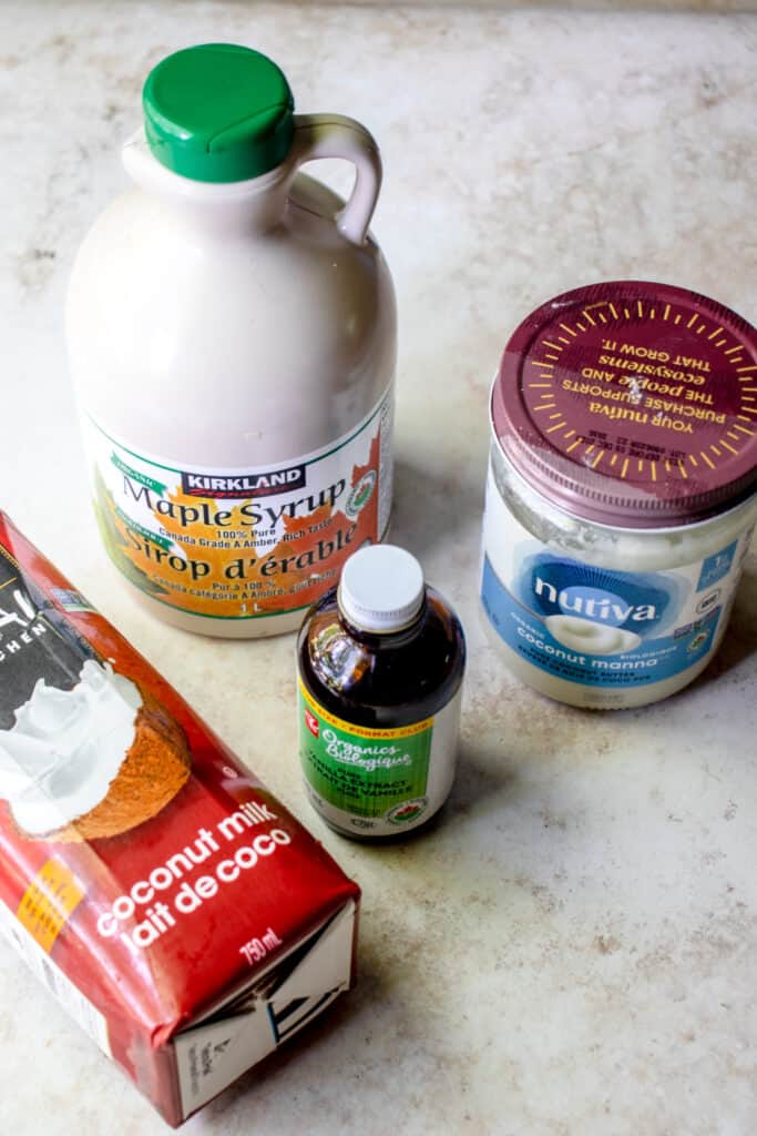 Ingredients to make the maple glaze. Coconut milk, maple syrup, vanilla and coconut butter.