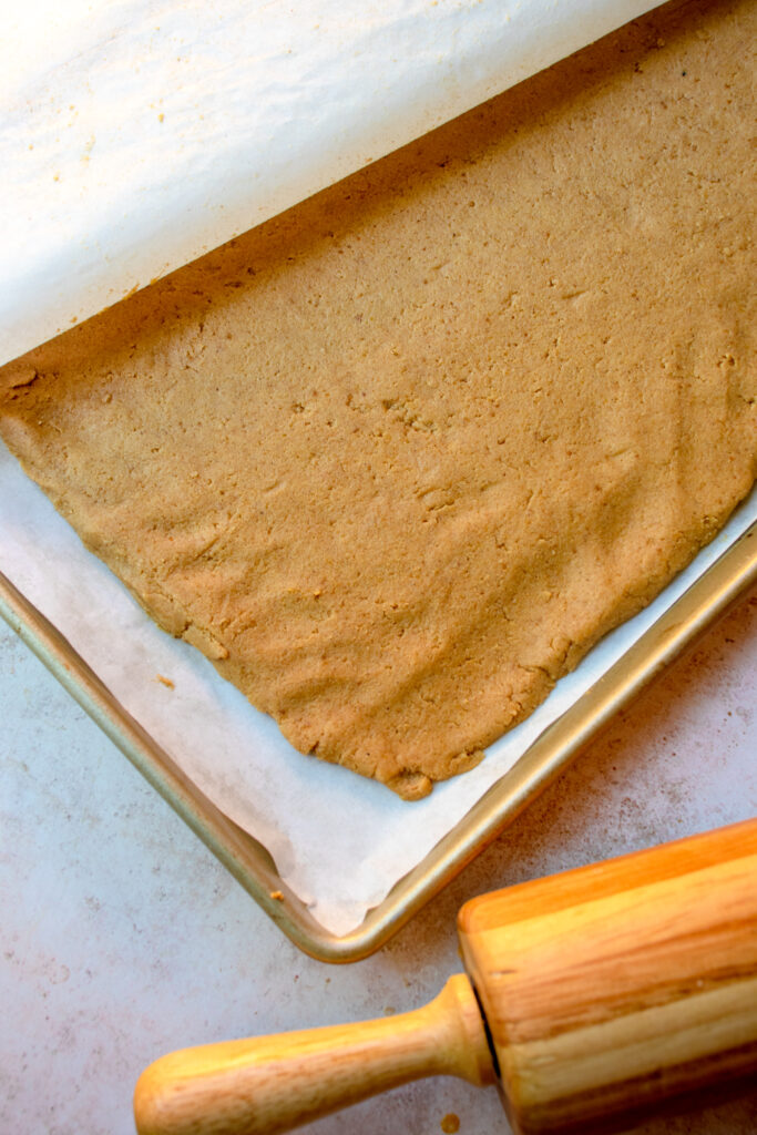 baking tray with pumpkin roll dough