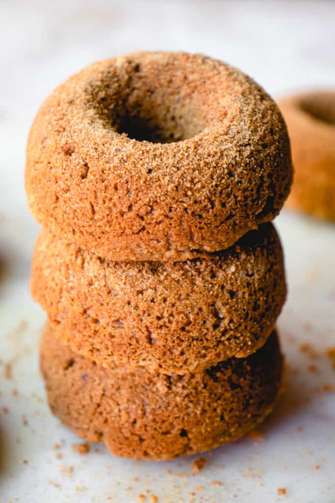 Three stacked apple cider donuts