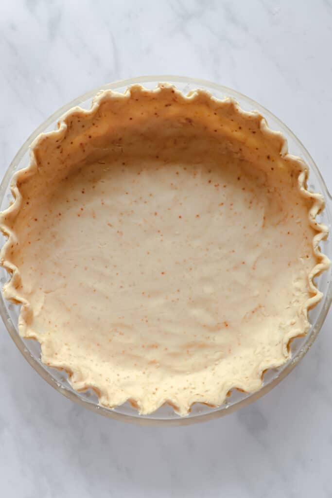 pre-baked grain-free pie crust pressed into glass pie dish with crimped edges