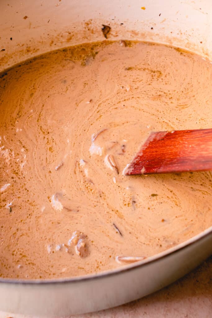 stir the puréed soup together with the unblended soup in a large pot