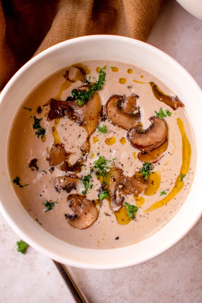 bowl of Gluten-Free Cream of Mushroom Soup with garnish