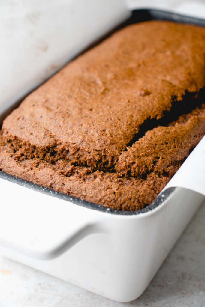 Baked Gluten-Free Gingerbread Loaf in a loaf pan.