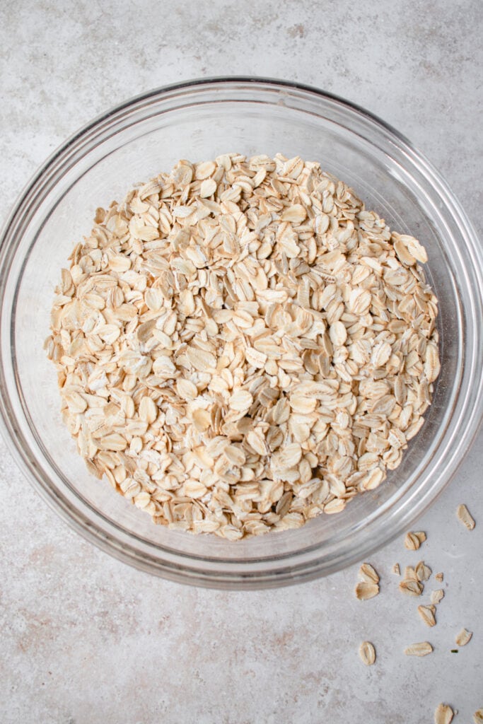 A glass bowl with gluten-free oats.