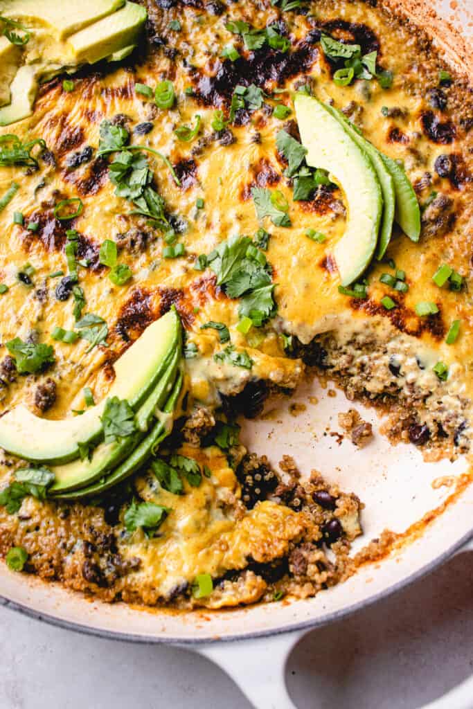 Easy Mexican Casserole garnished with avocado slices
