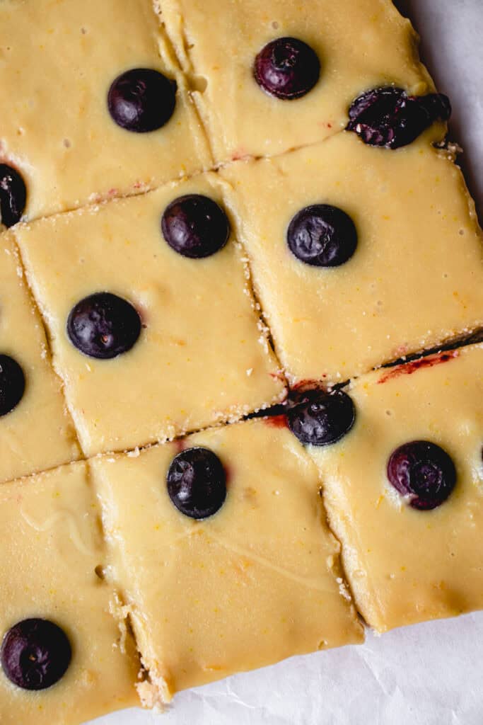 Set Gluten-free Lemon Blueberry Bars sliced into squares.