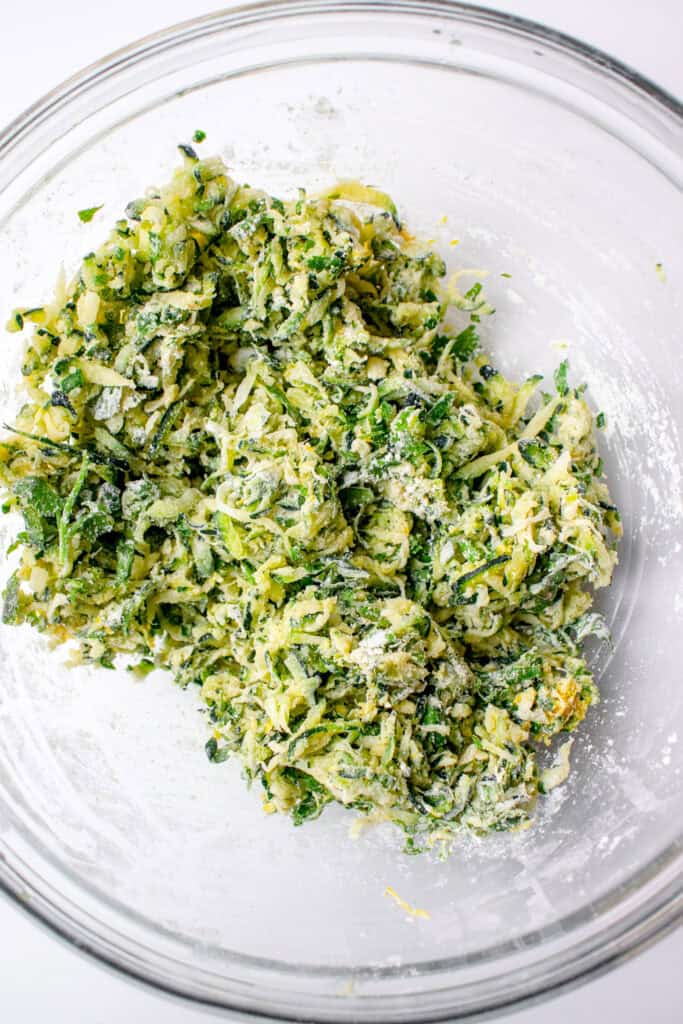 The zucchini fritter batter mixed together in a large bowl, before adding the flax eggs.