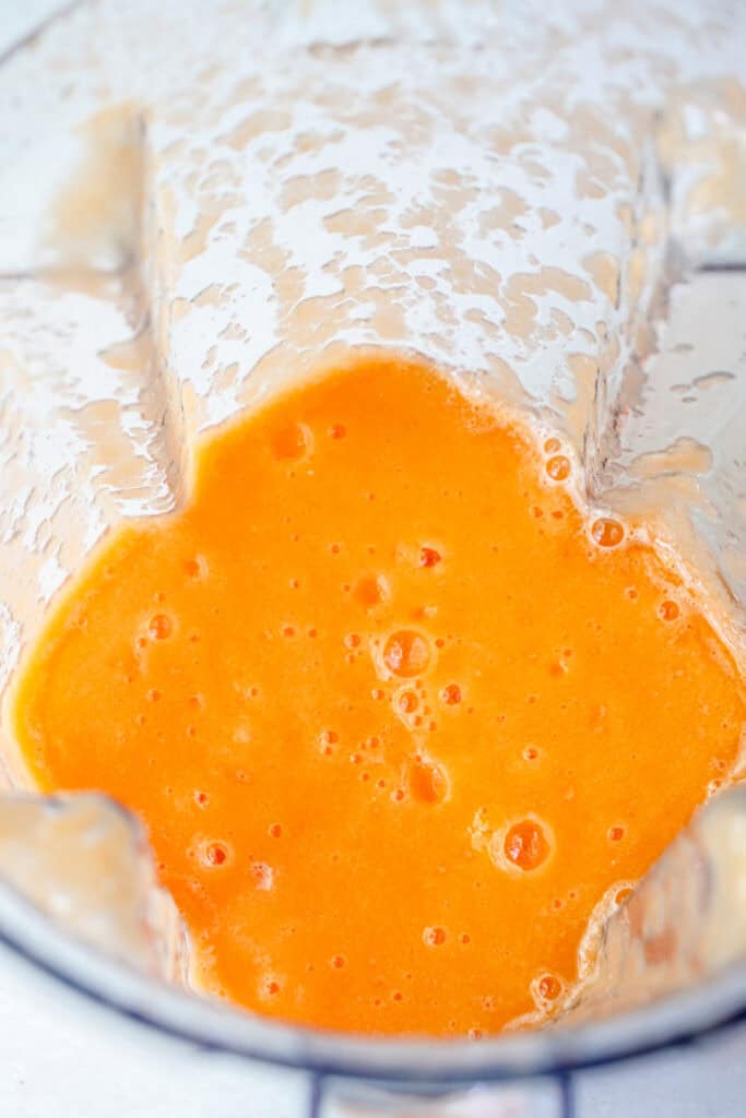 Puréed cantaloupe in a blender.