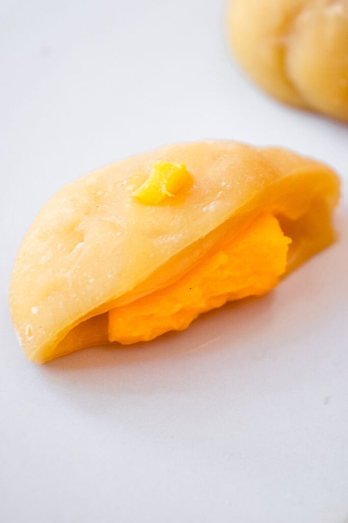 Cross section of Mango Mochi to see the mango filling inside the mango mochi dough.