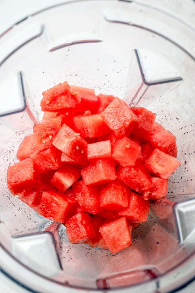 Cubed watermelon inside a blender.