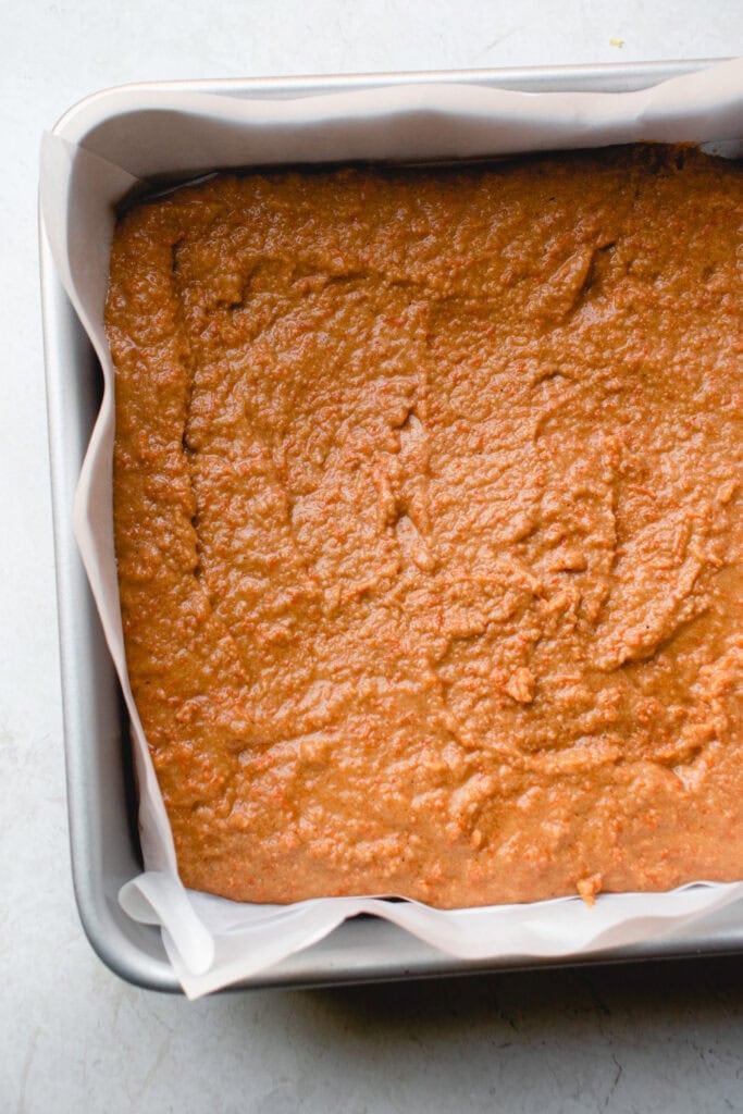 Batter transferred to a parchment-lined pan.